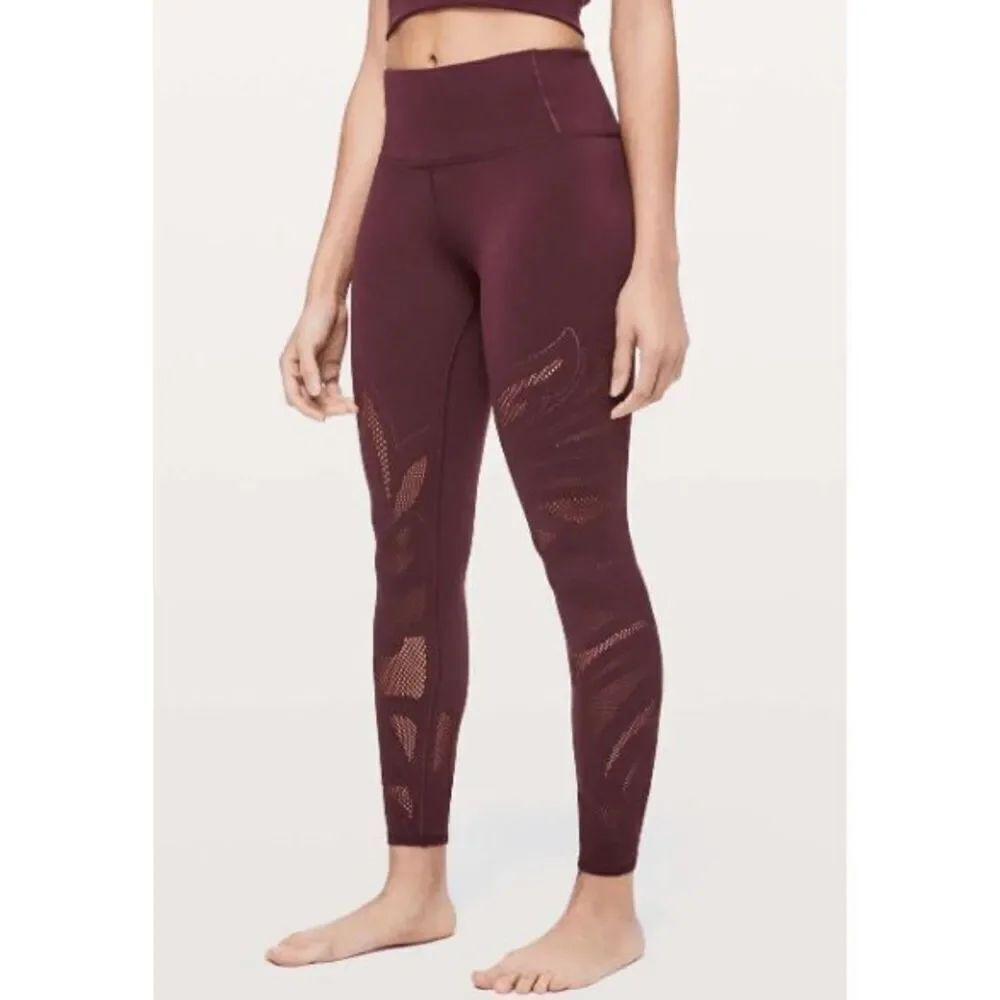 Lululemon size 12 burgundy Reveal tights/ leggings *FLAW*